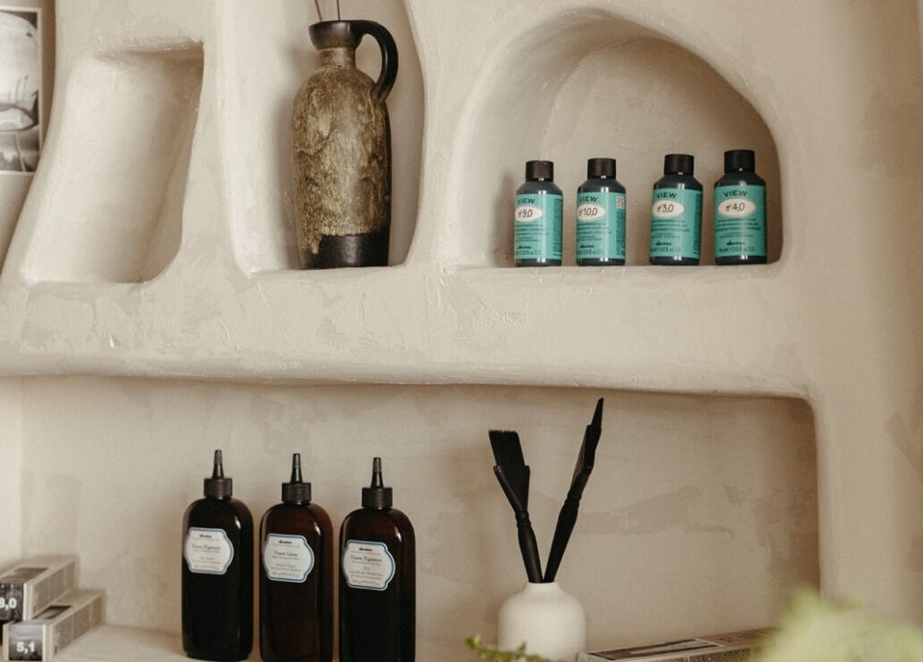 Stylish product shelves at M&Co. Hair Studio, Milton, Ontario, CA showcasing premium hair care items.