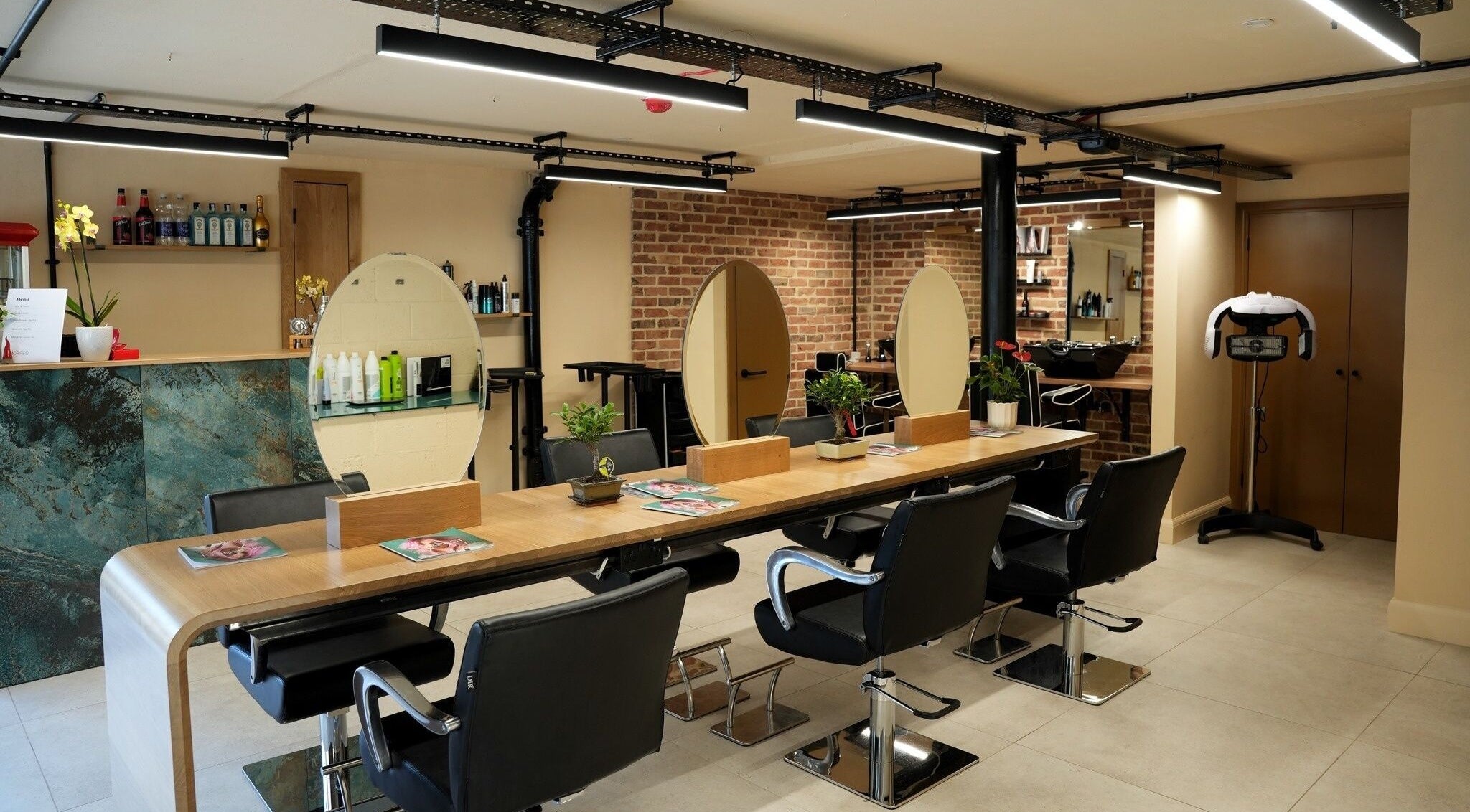 Modern salon chairs and mirrors at Morresi Hair Stylist, Cambridge, England, GB.