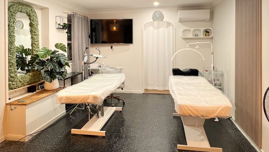 Bright treatment room at Flashy Lashies & Beauty, Lethbridge Park, New South Wales, AU, featuring two spa beds.