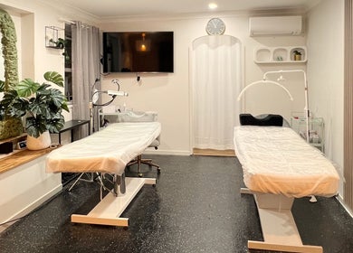 Bright treatment room at Flashy Lashies & Beauty, Lethbridge Park, New South Wales, AU, featuring two spa beds.