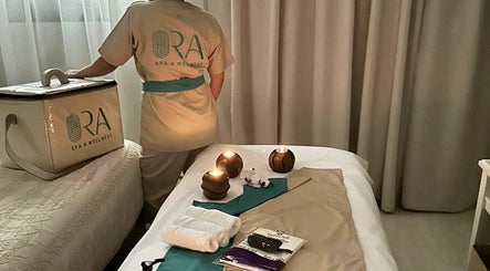 Relaxing spa room at Ora Spa Home Service, Riyadh, Riyadh Province, SA, with candles and massage items.