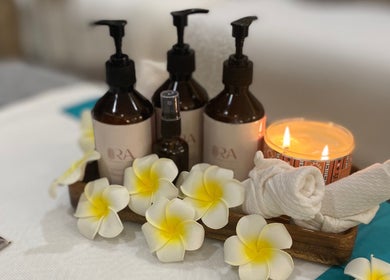 Ora Spa Home Service essentials with flowers and candle, Riyadh, Riyadh Province, SA.