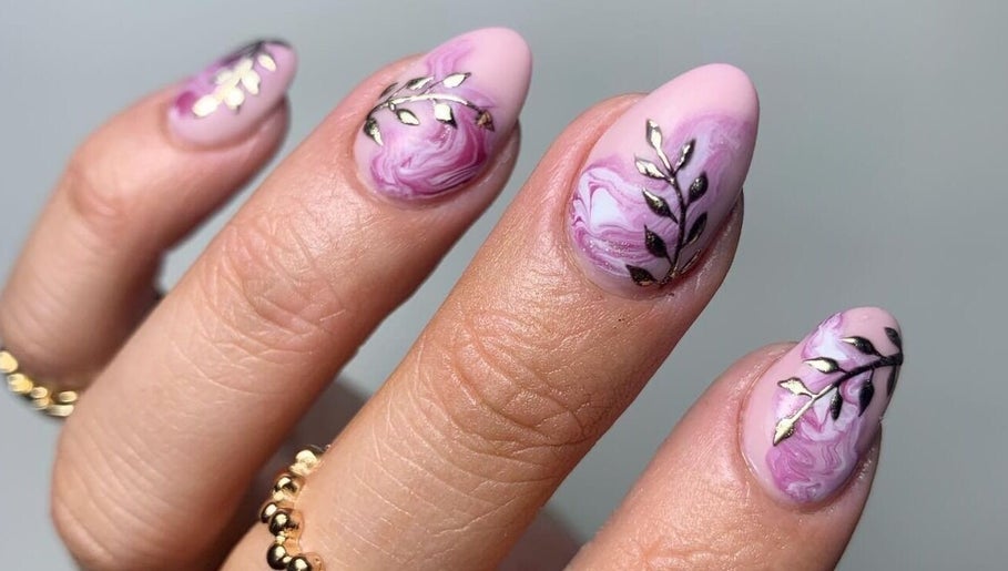 Elegant pink marble nails with leaf designs at Nails & Lashes By Amy, Saint Martin's, England, GB.