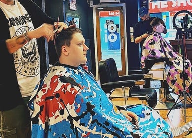 Stylish haircuts at Oioi Barber Company South Street in Perth, GB, showcasing skilled barbers in action.