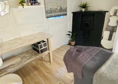 Tranquil treatment room at Eden Beauty & Holistics - Bidford, Bidford-on-avon, England, GB with plush massage table.