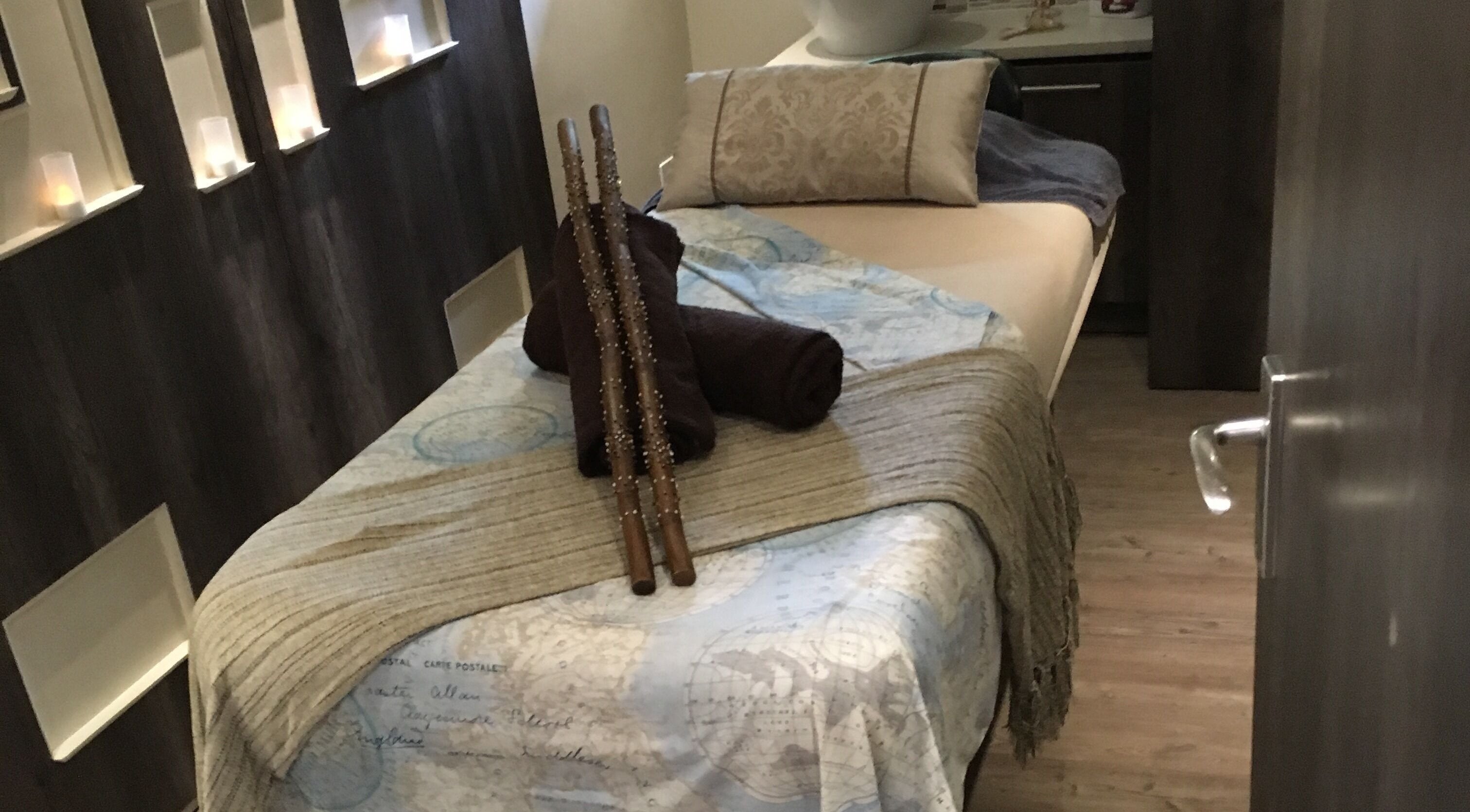 Relaxing massage room at Urban Bliss Spa, Johannesburg, Gauteng, ZA, with a plush bed and ambient lighting.