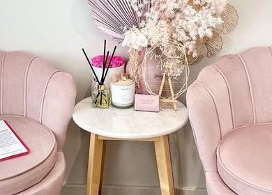 Elegant pastel seating area at Envy Beauty Aesthetics Pty Ltd in Hoxton Park, New South Wales, AU.