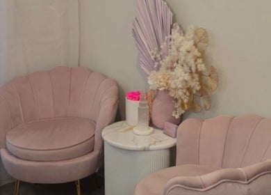 Elegant pink seating area at Envy Beauty Aesthetics Pty Ltd, Hoxton Park, New South Wales, AU.