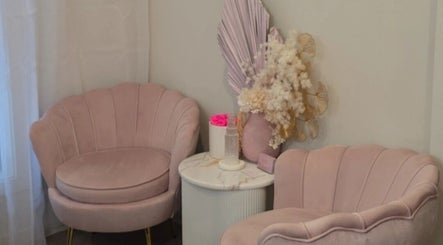 Elegant pink seating area at Envy Beauty Aesthetics Pty Ltd, Hoxton Park, New South Wales, AU.