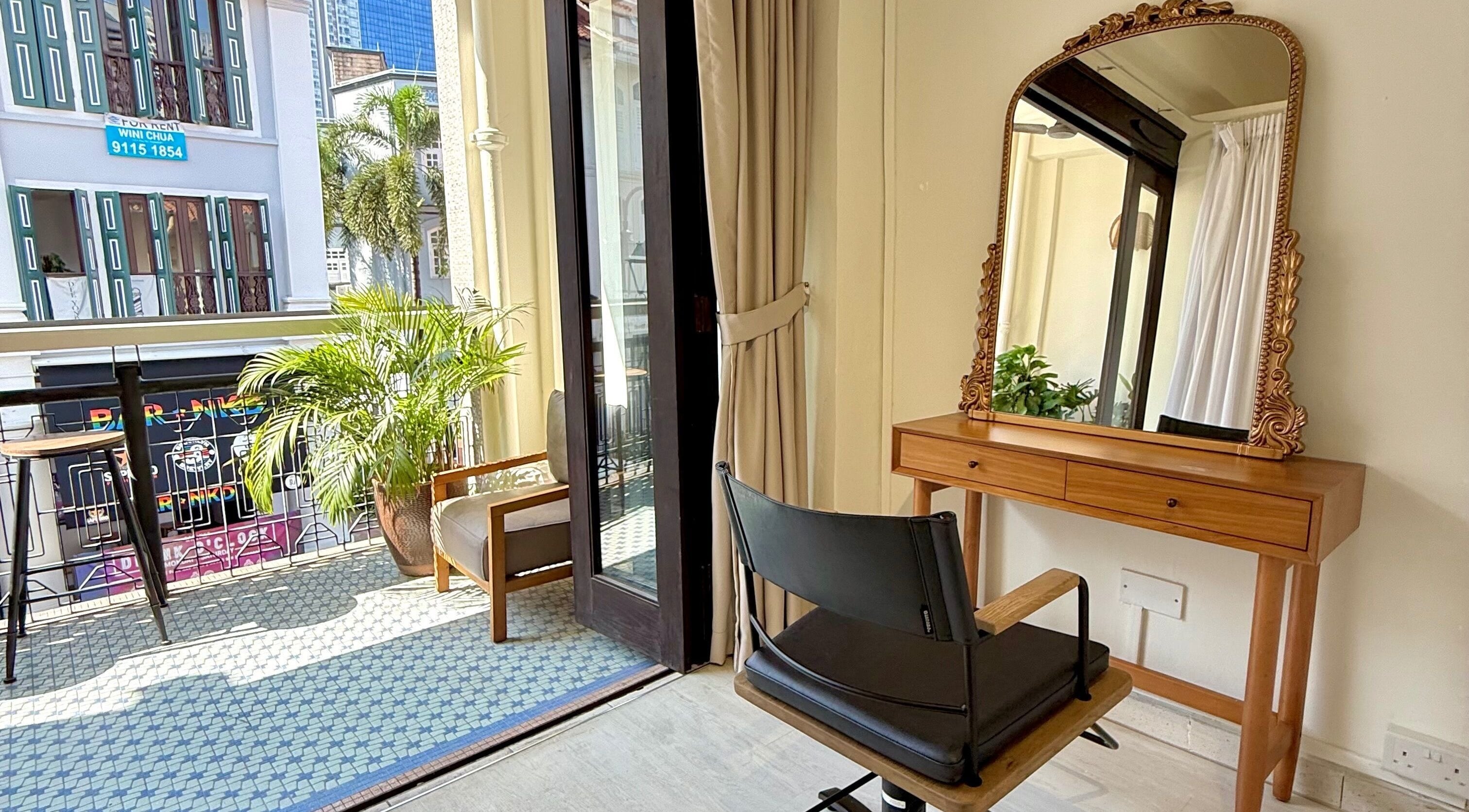 Bright beauty station at Sankakkei Club Street in Singapore, Singapore, SG with ornate mirror and greenery.