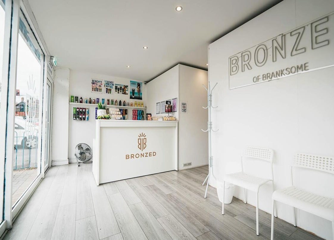 Bright reception at Bronzed of Branksome, Poole, England, GB showcasing products and seating area.