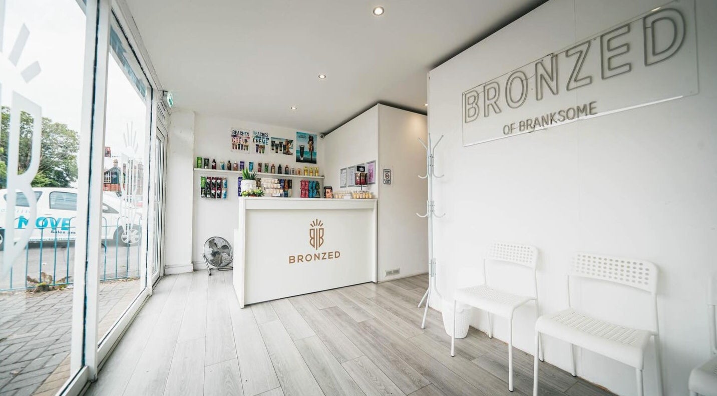 Bright reception at Bronzed of Branksome, Poole, England, GB showcasing products and seating area.