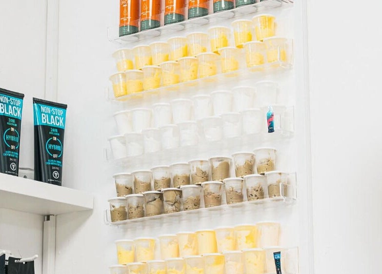 Vibrant product display at Bronzed of Branksome, Poole, England, GB showcasing tanning lotions and creams.