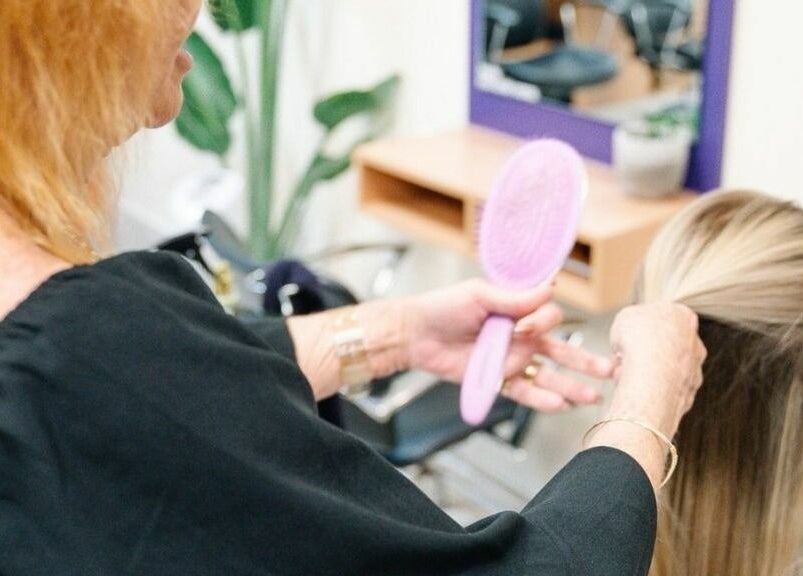 Hair styling session at Meraki Curlz in Mount Sheridan, Queensland, AU, featuring a professional stylist.