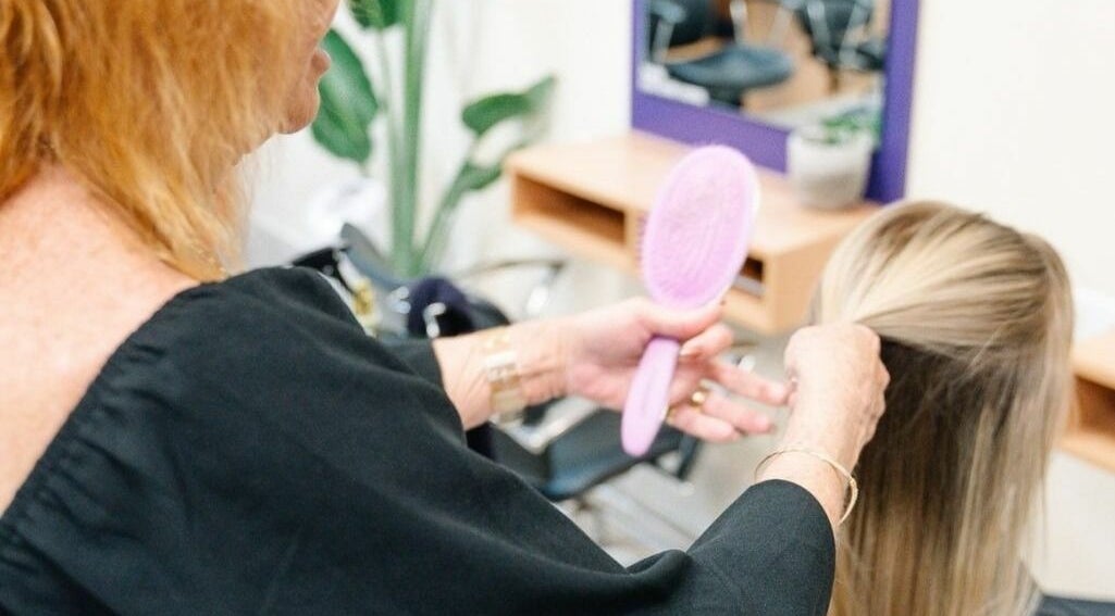 Hair styling session at Meraki Curlz in Mount Sheridan, Queensland, AU, featuring a professional stylist.
