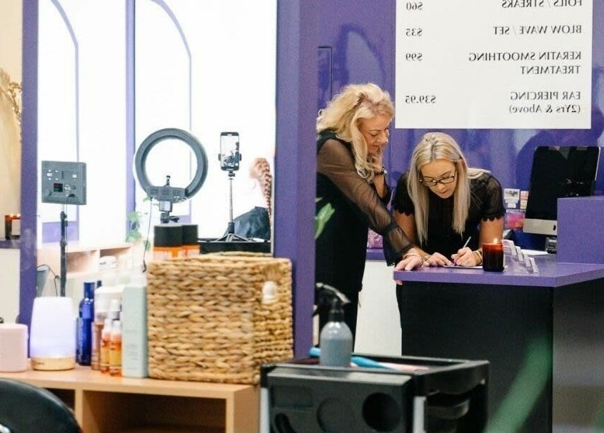 Reception area at Meraki Curlz, Mount Sheridan, Queensland, AU, with staff assisting customers.