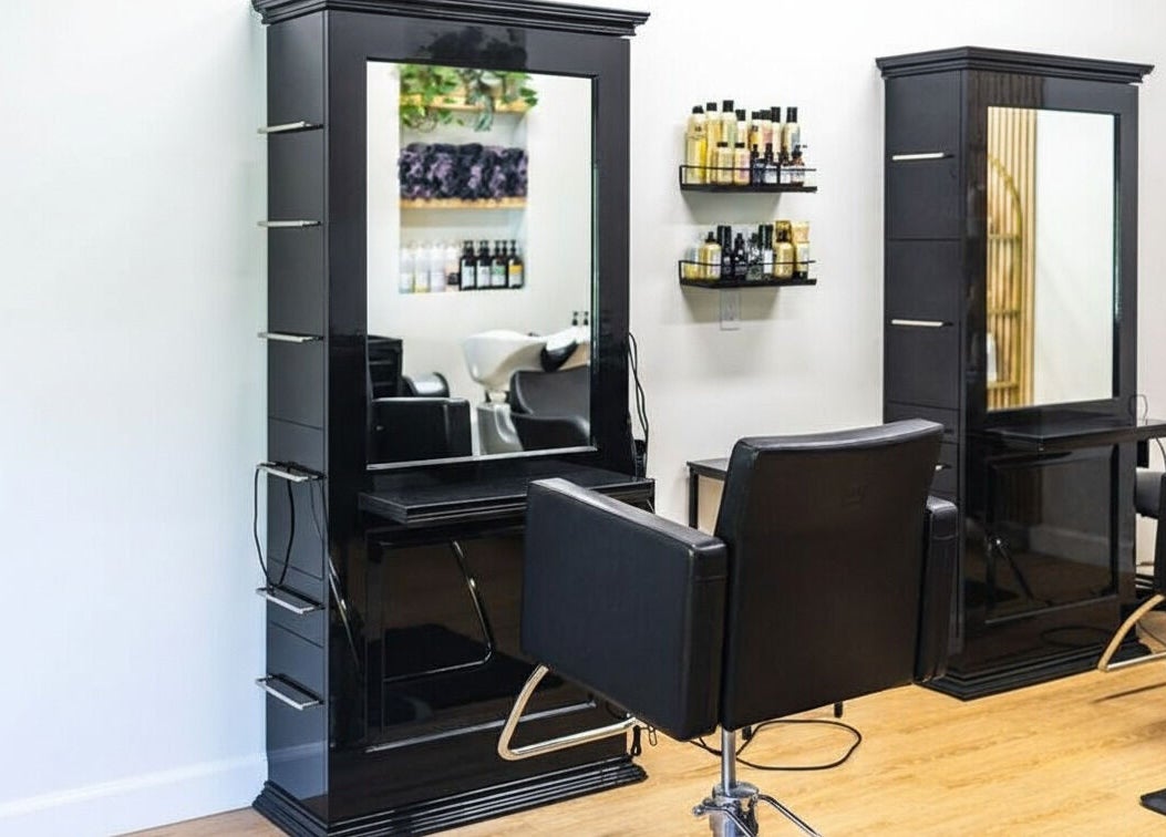 HBL Studio - Lauren Gibson in Millbrook, Ontario, CA showcases elegant black salon chairs and styling stations.