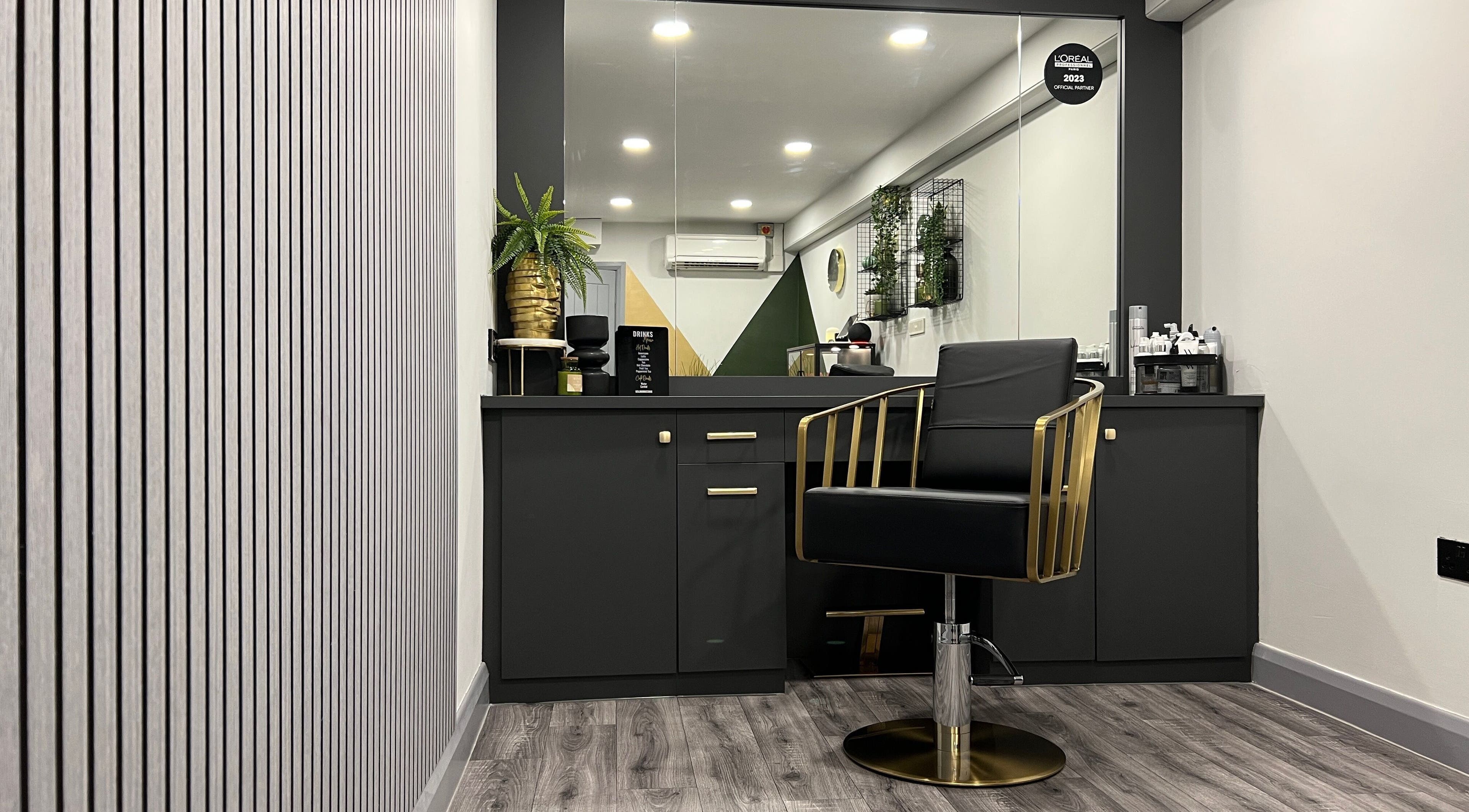 Elegant styling chair and modern decor at Benjamin Ross Hair, Derby, England, GB.