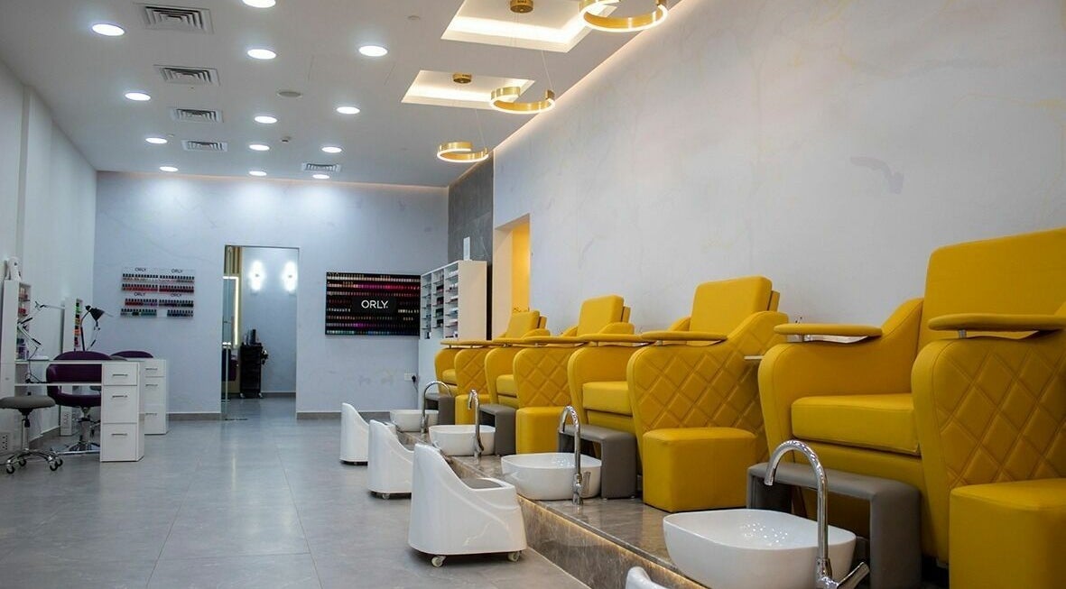 Feel pampered at Feels Beauty Lounge and Spa, Abu Dhabi, AE with luxurious yellow pedicure chairs and serene ambiance.