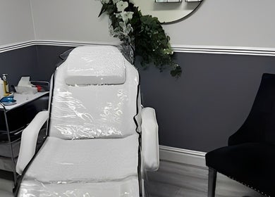 Relaxing treatment chair at Howden Skin Clinic in Howden, England, GB, surrounded by elegant decor.