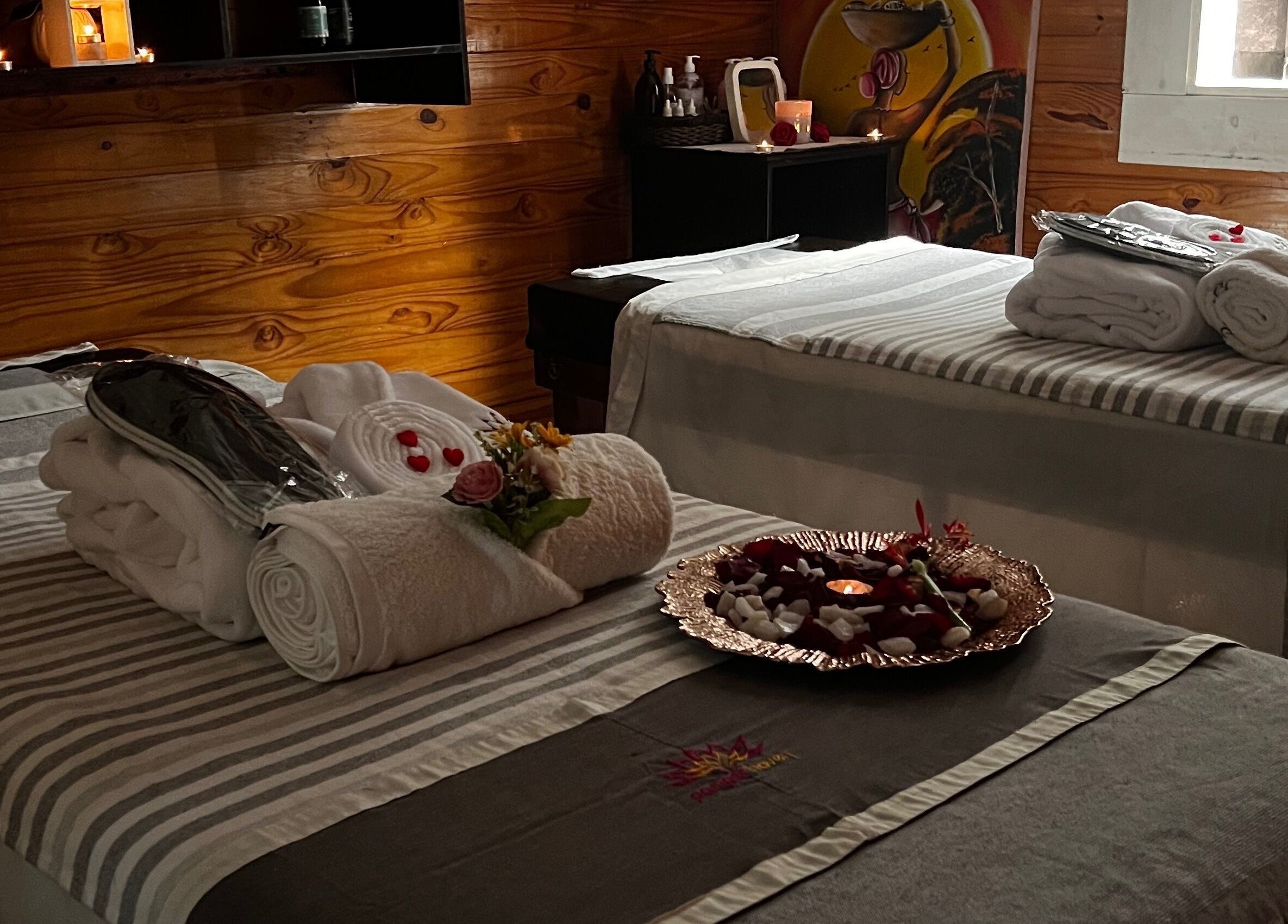 Tranquil massage room at Pamper Haven Aesthetic Spa, Harare with cozy linens and ambient lighting for relaxation.