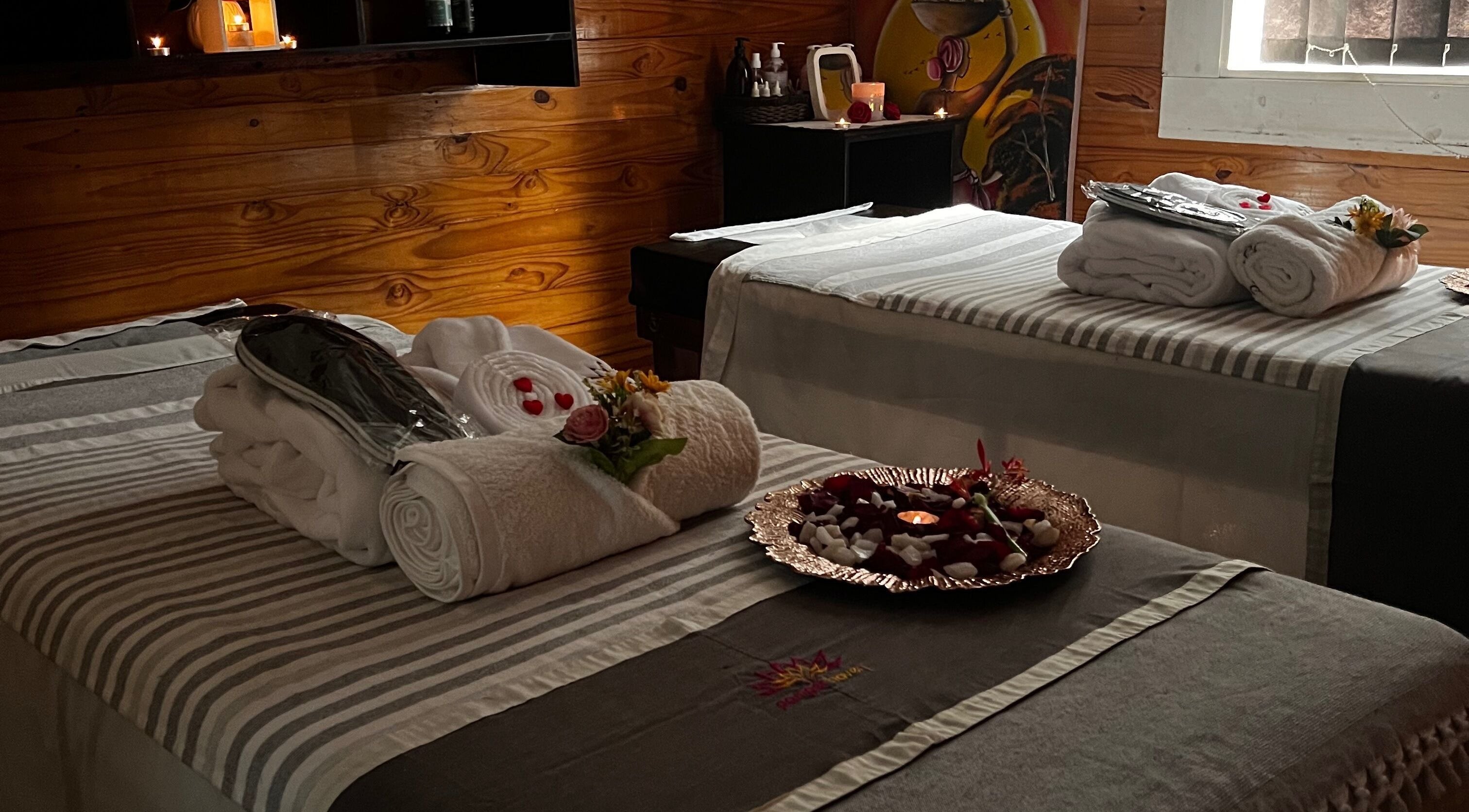 Tranquil massage room at Pamper Haven Aesthetic Spa, Harare with cozy linens and ambient lighting for relaxation.