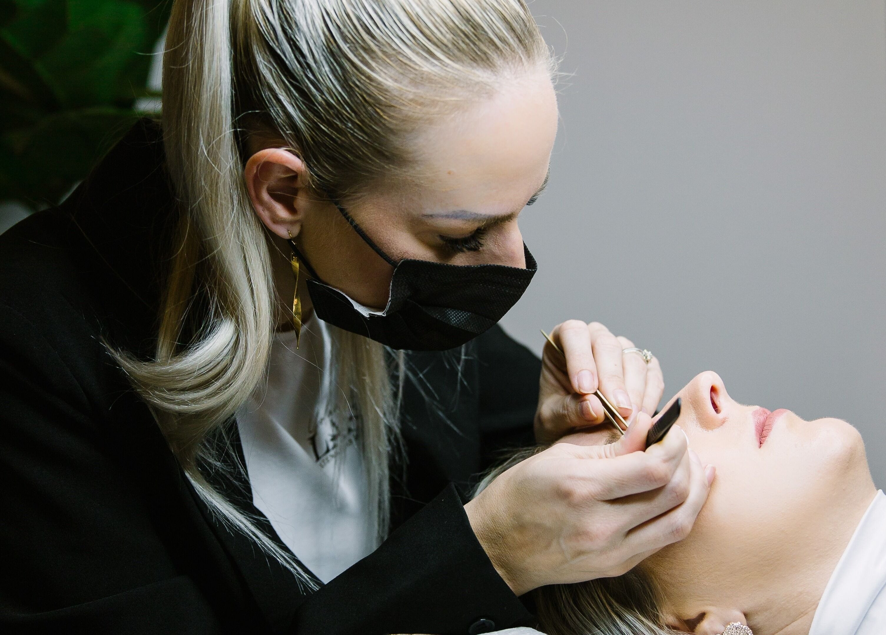 Professional applying eyelash extensions at Yolandie’s Lash Extensions and Aesthetics, Cape Town, Western Cape, ZA.