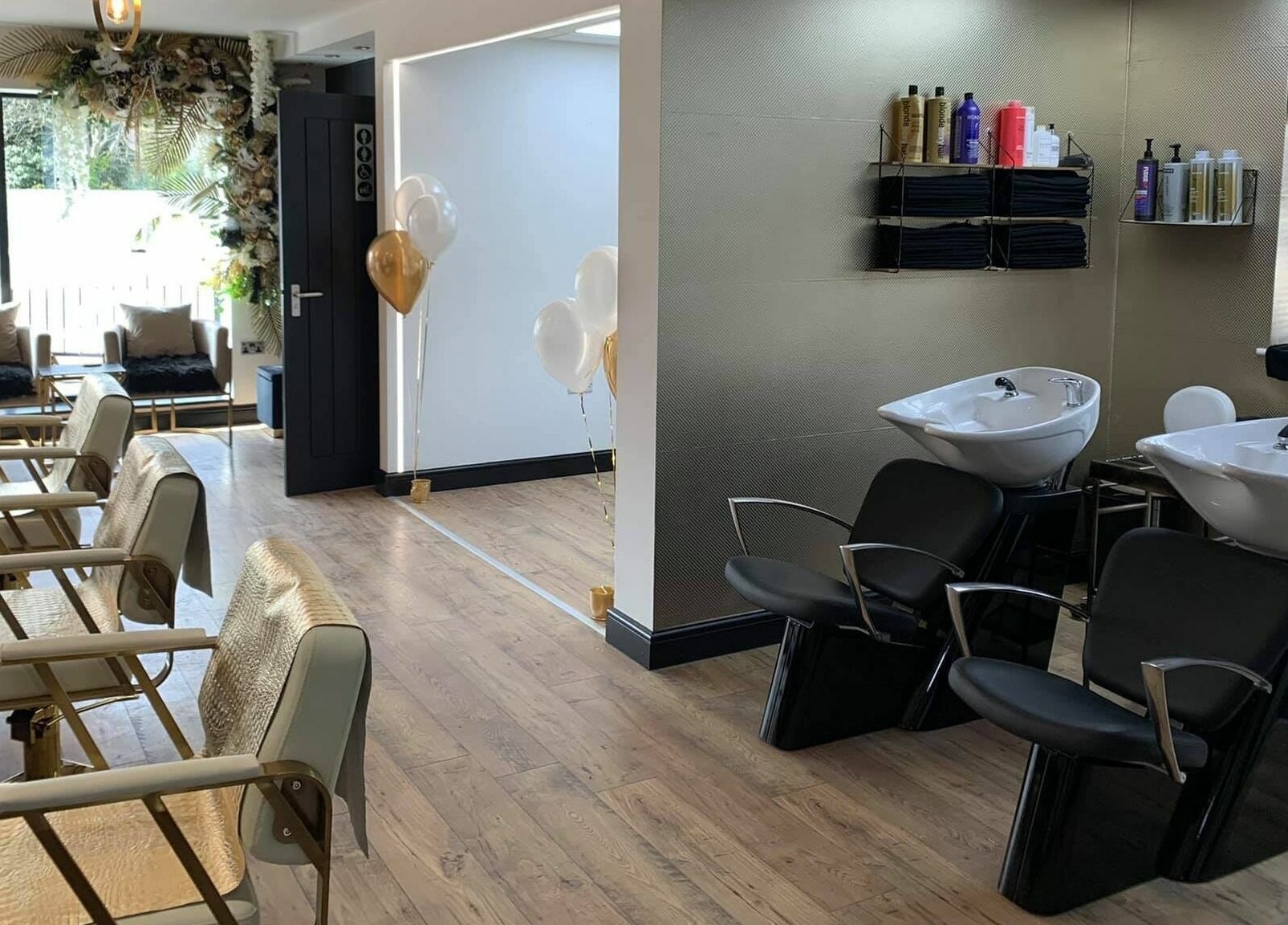Bright and modern interior of Örro Hair and Beauty Salon in Rotherham, England, with stylish chairs and washbasins.