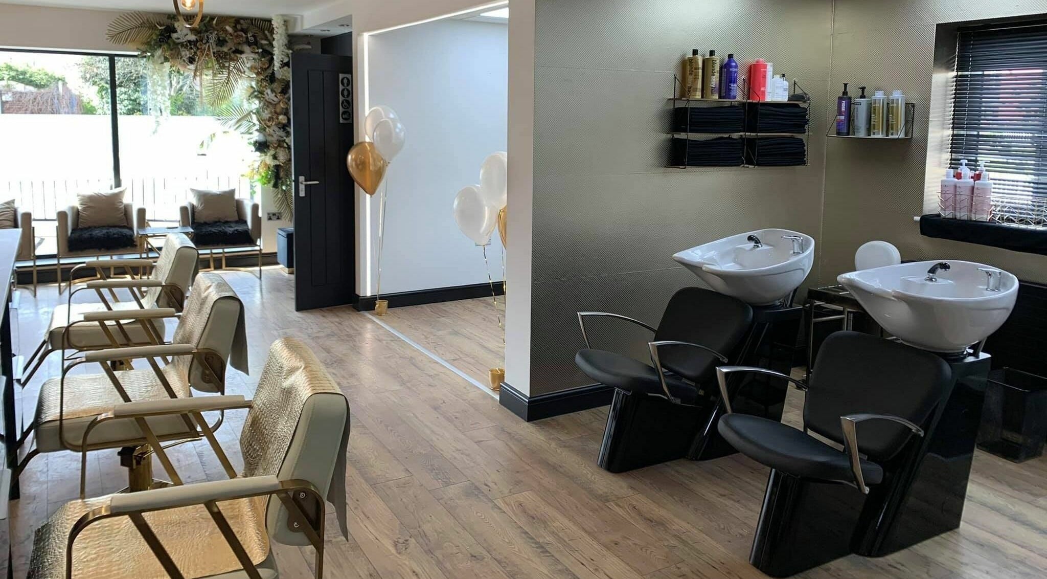 Bright and modern interior of Örro Hair and Beauty Salon in Rotherham, England, with stylish chairs and washbasins.