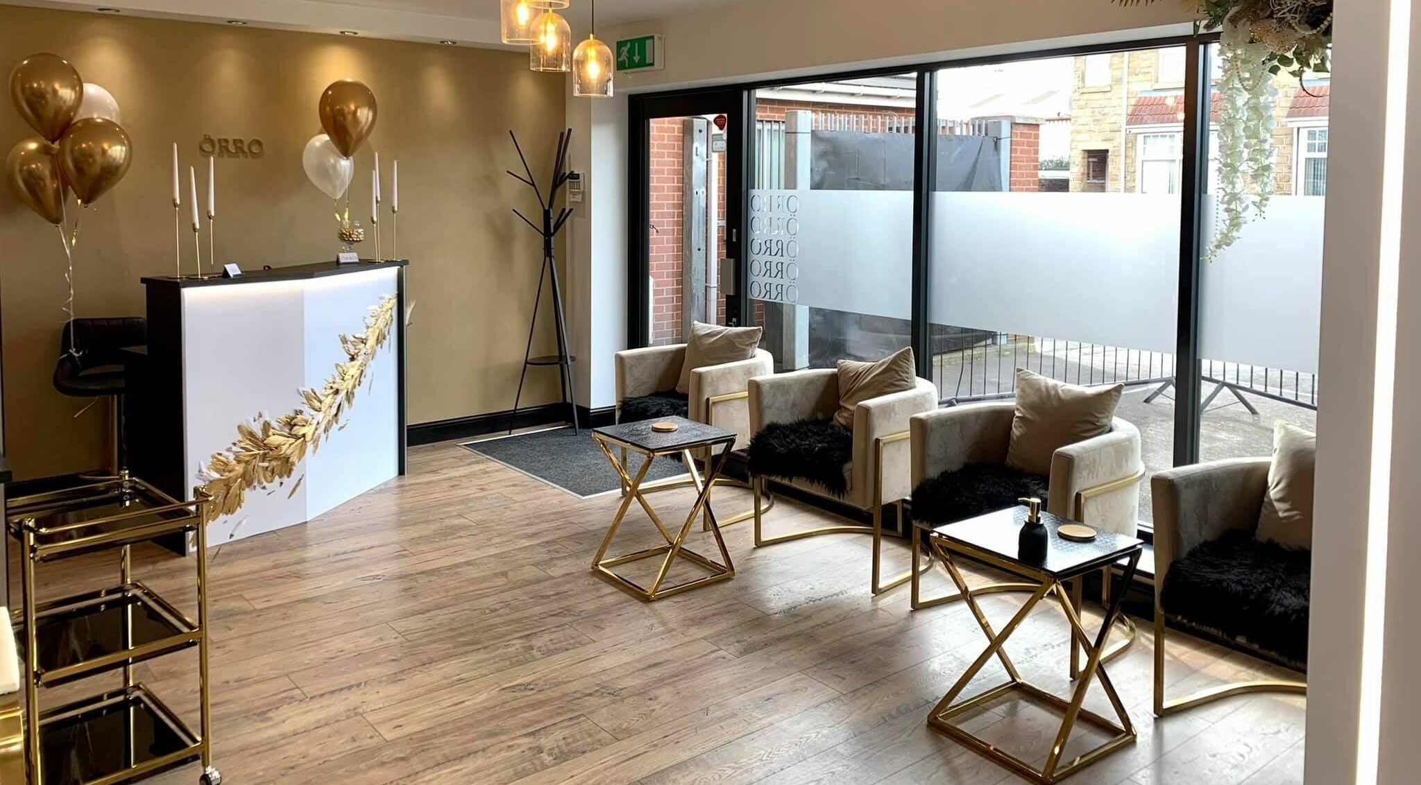 Stylish reception area of Örro Hair and Beauty Salon in Rotherham, England, GB, featuring chic seating.
