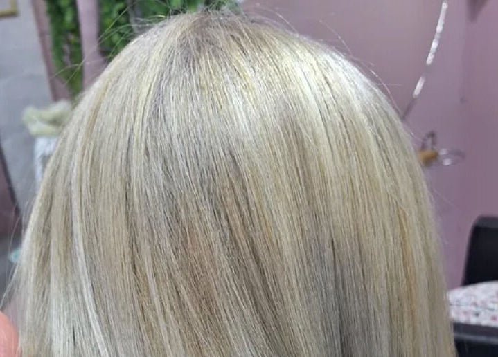 Sleek blonde hairstyle at My Hair Department in Cape Town, Western Cape, ZA, showcasing expert color techniques.