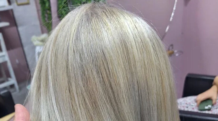 Sleek blonde hairstyle at My Hair Department in Cape Town, Western Cape, ZA, showcasing expert color techniques.
