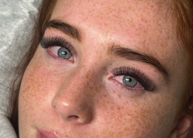 Close-up of a woman's eye with eyelash extensions at ByMaisy, Bexleyheath, England, GB.