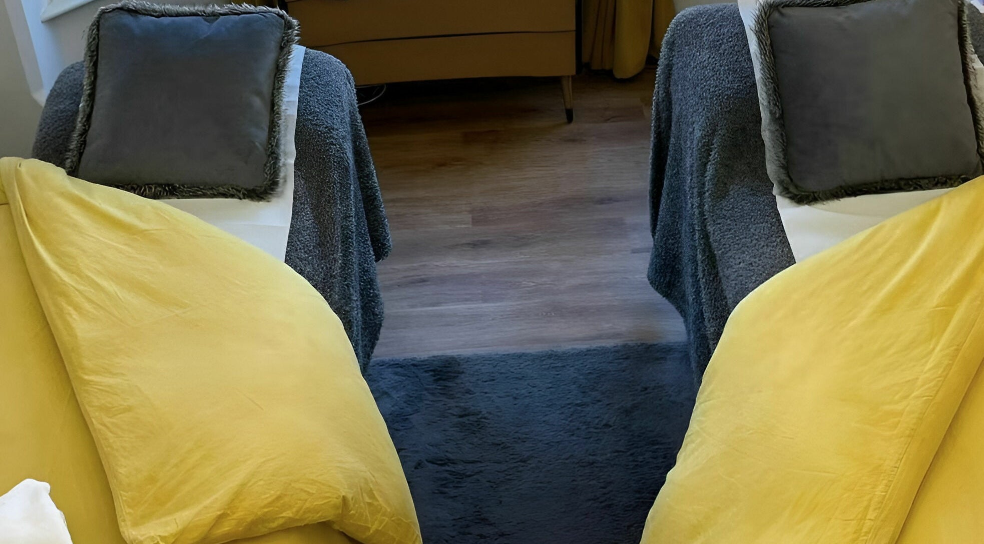 Inviting treatment setup at The Sunshine Store, Radcliffe on Trent, England, GB with plush yellow and grey decor.