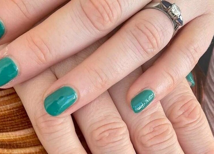 Stylish green nails with ring at The Sunshine Store, Radcliffe on Trent, England, GB.