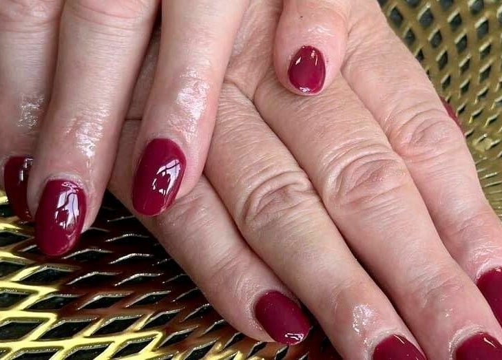 Elegant crimson nails at The Sunshine Store, Radcliffe on Trent, England, GB enhancing beauty and style.