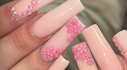 Elegant pink floral nail design by By Viky in Bilston, England, GB, showcasing expert artistry.