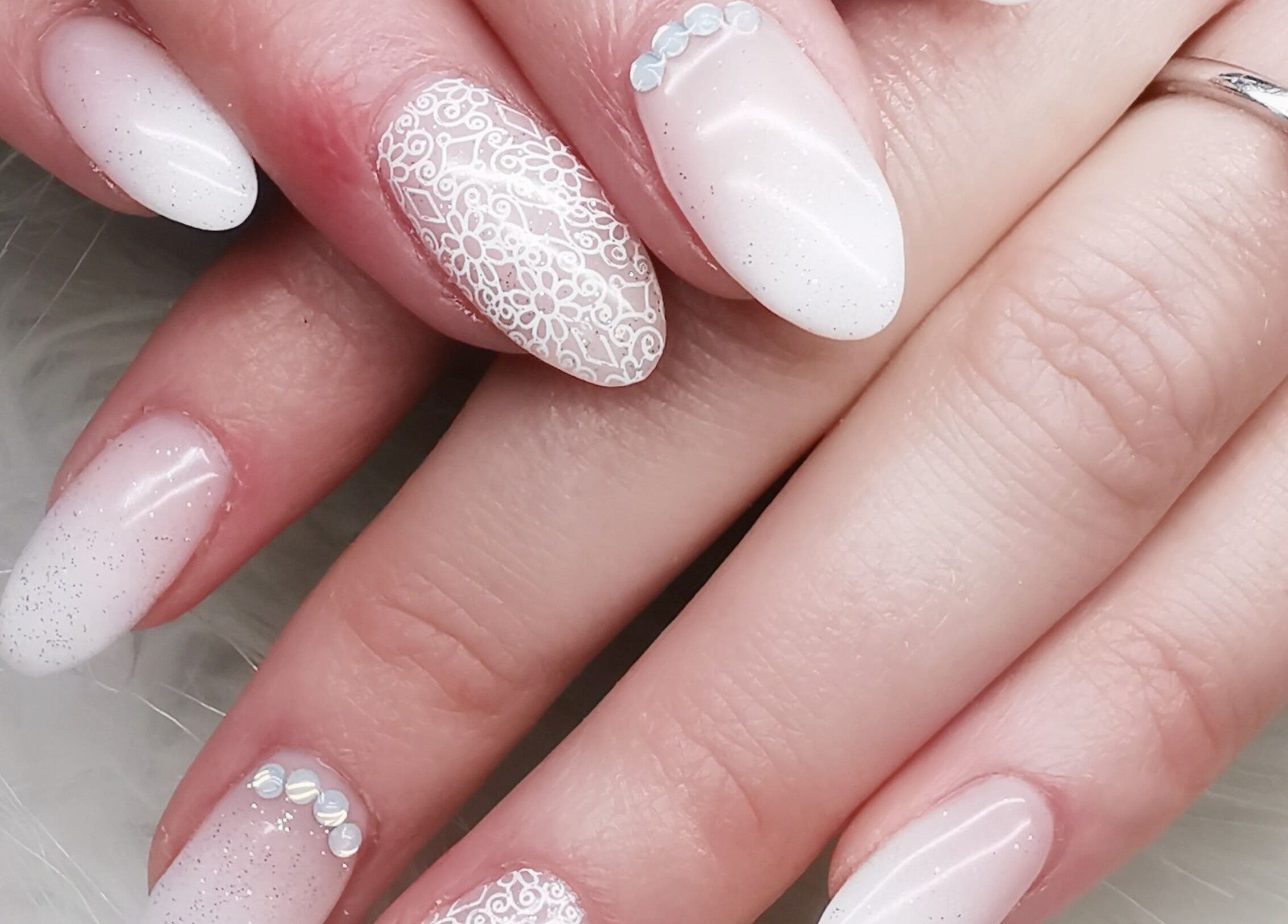 Elegant lace nail art at Nails.Com Potch in Potchefstroom, North West, ZA offers intricate beauty designs.