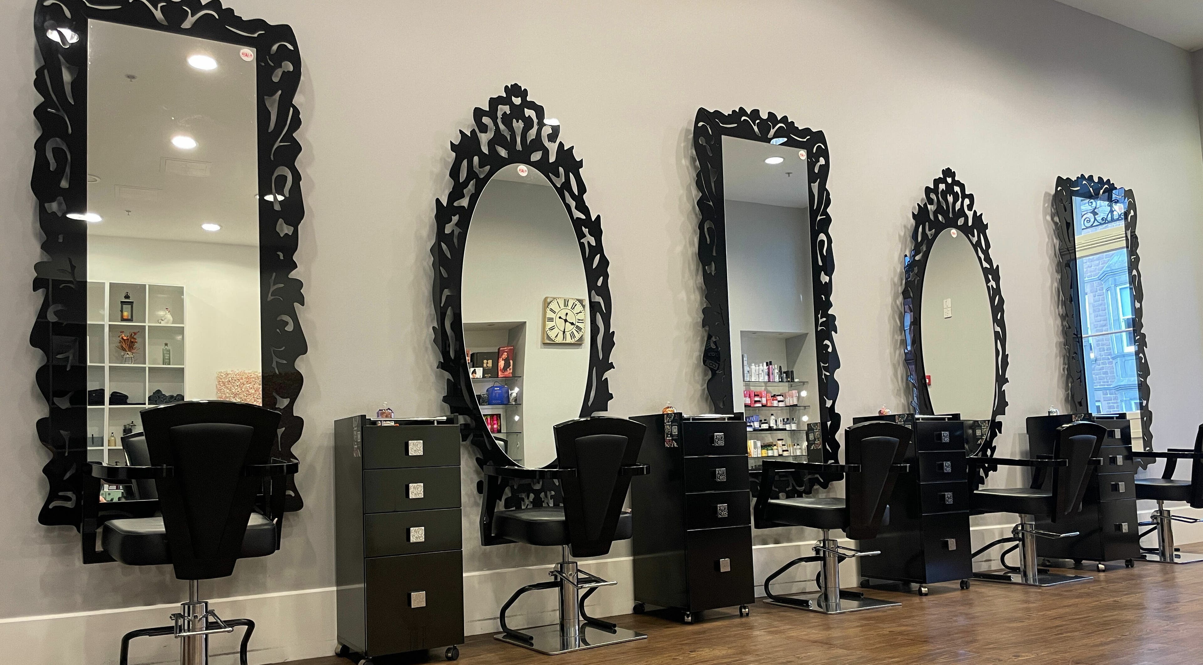 Elegant styling stations with ornate mirrors at House of Hair, Guernsey, Saint Peter Port, GG.