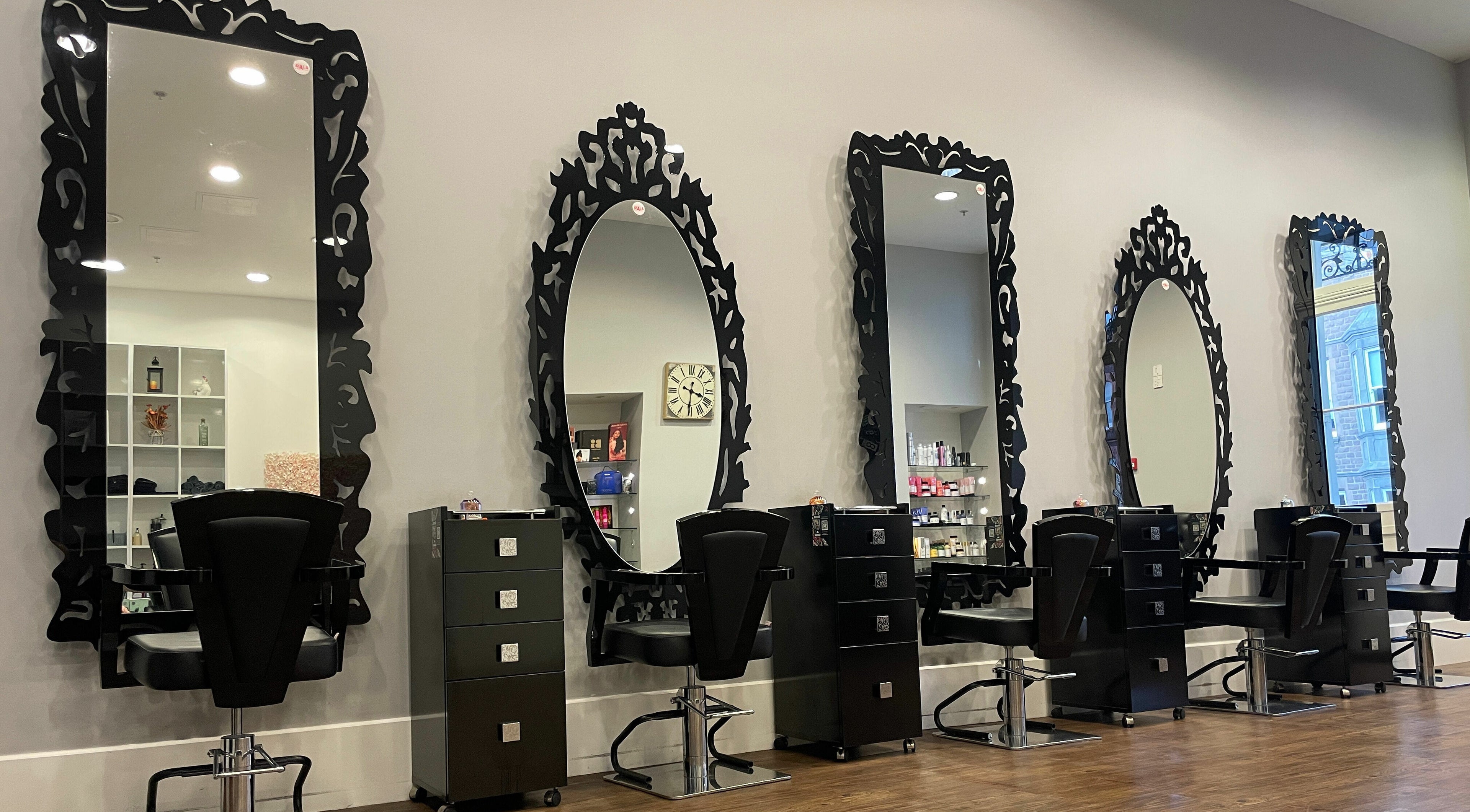 Elegant styling stations with ornate mirrors at House of Hair, Guernsey, Saint Peter Port, GG.