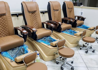 Luxurious pedicure chairs at Lunar Nails in The Villages, Florida, US ready for a relaxing session.