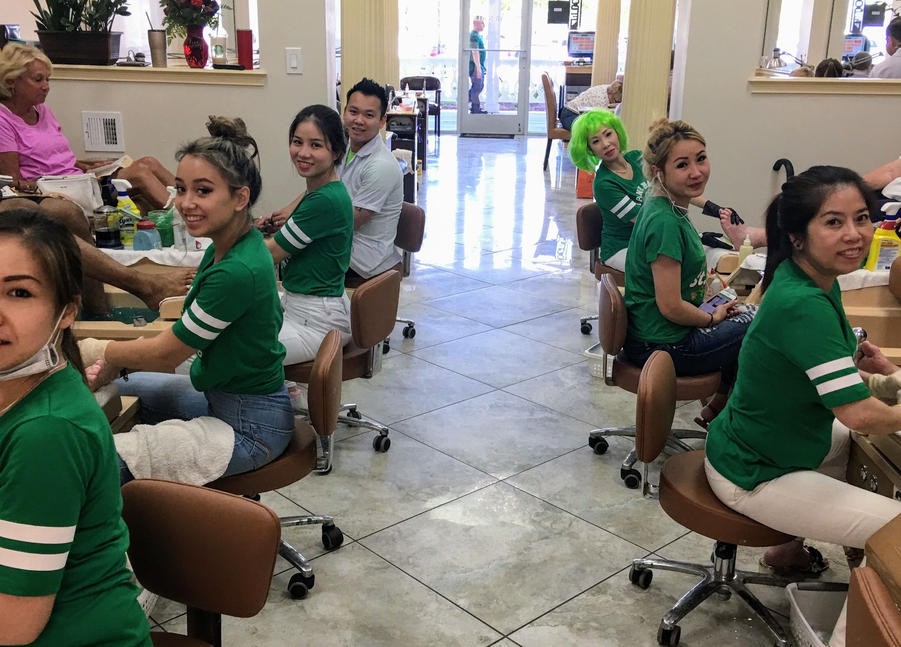 Guests enjoy pedicures at Lunar Nails, The Villages, Florida, US, with expert staff attending to their needs.