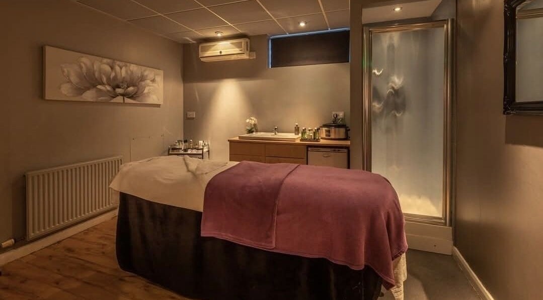 Relaxing treatment room at Shass Therapy @ Gloucester Robinswood Hotel, Gloucester, England, GB with plush table.