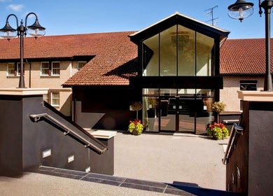 Entrance of Shass Therapy @ Gloucester Robinswood Hotel in Gloucester, England, GB, featuring charming architecture.