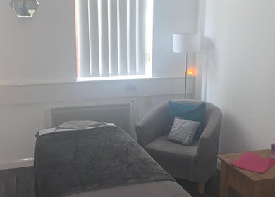 Cozy massage room at Shass Therapy Mobile Massage, Gloucester, England, GB, with soft lighting and comfortable decor.
