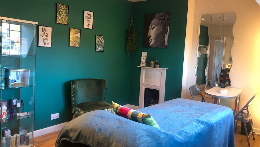 Calming therapy room at Revive Beauty Painswick, Gloucester, England, GB, with a serene green decor.
