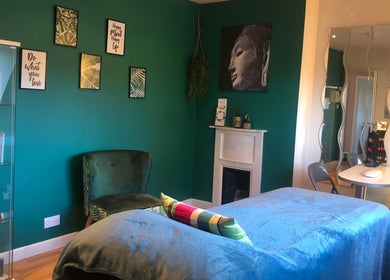 Calming therapy room at Revive Beauty Painswick, Gloucester, England, GB, with a serene green decor.