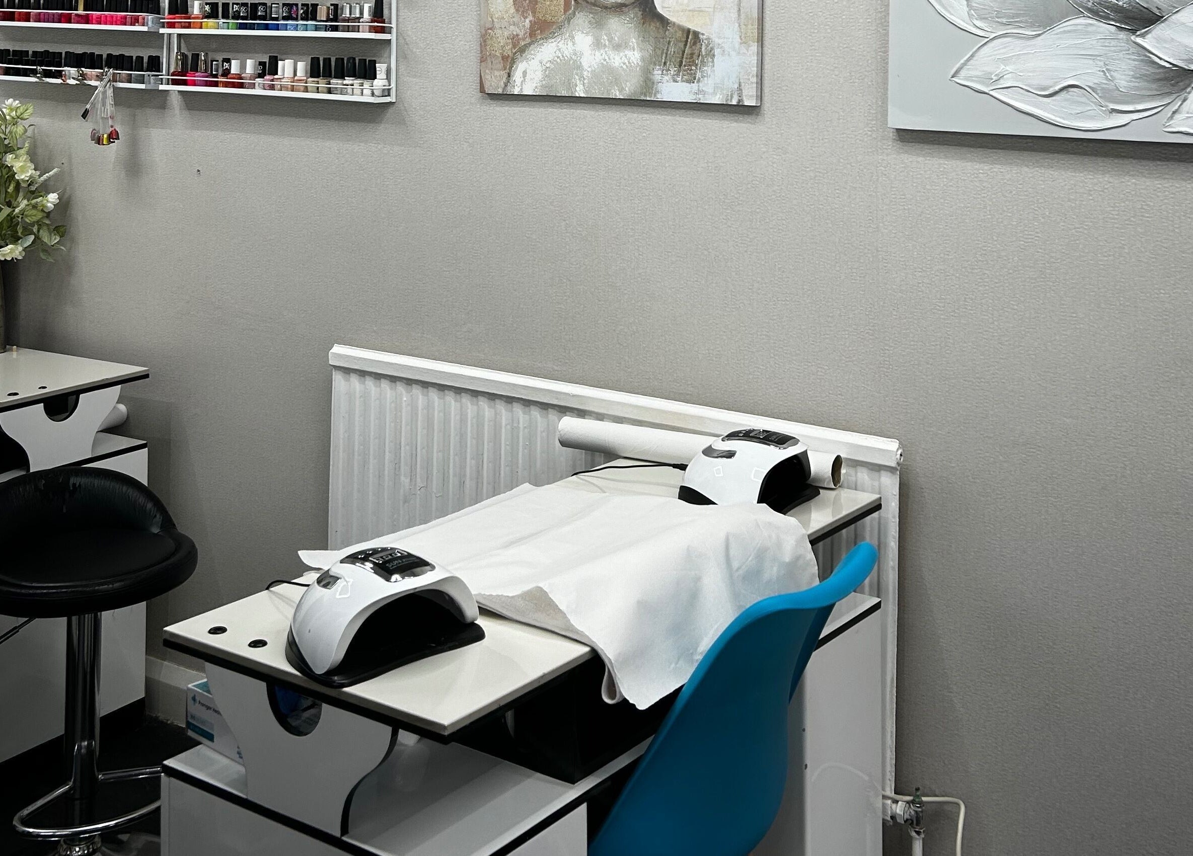 Nail salon setup at Hands of Buddha, featuring nail stations in a calming, modern space in Sale, England, GB.