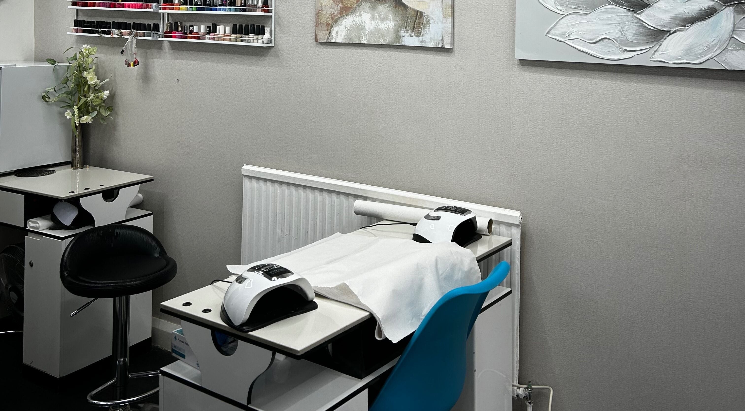 Nail salon setup at Hands of Buddha, featuring nail stations in a calming, modern space in Sale, England, GB.