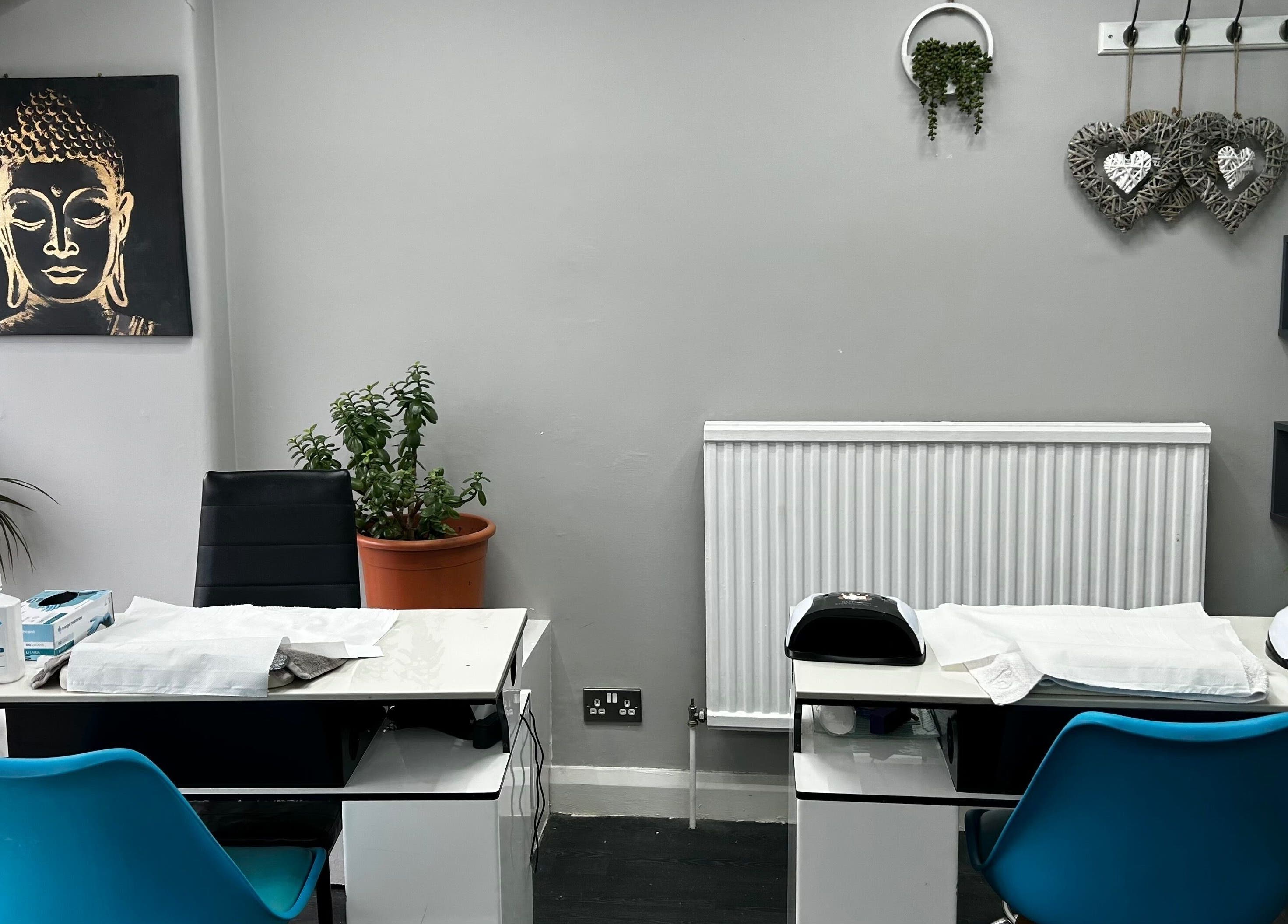 Tranquil nail station at Hands of Buddha, Sale, England, GB, featuring calm decor and Buddha art.